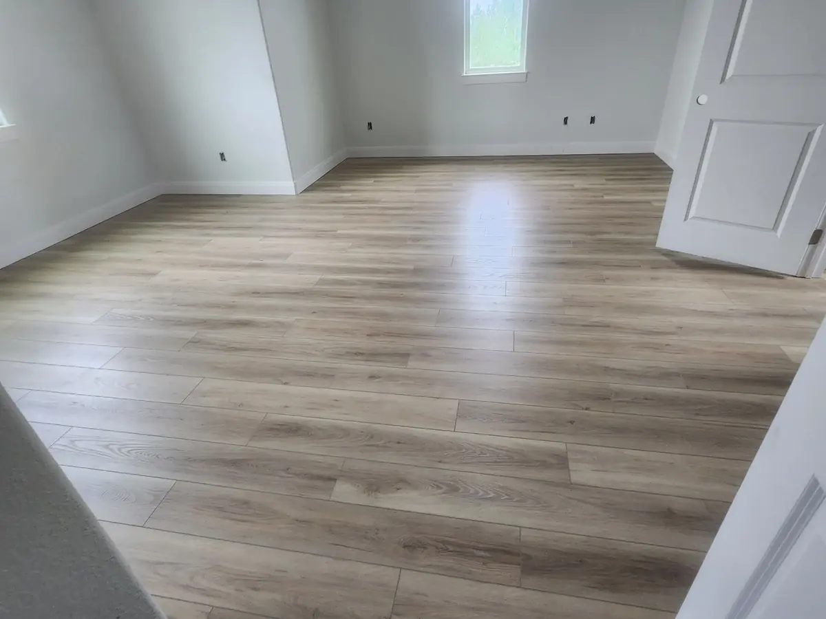 Wide plank vinyl flooring through connected rooms